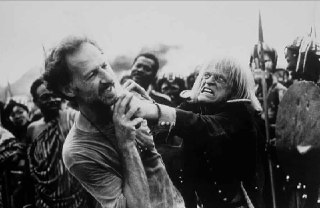 Actor Klaus Kinski holding a machete to director Werner Herzog’s throat during t...
