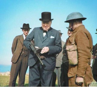 Winston Churchill inspects a Tommy gun, England, 1940.Time Machine | Historical Photo