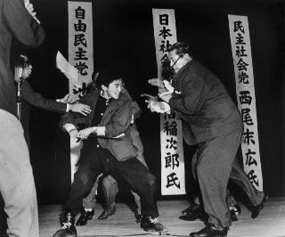 Otoya Yamaguchi attempting to stab Inejirō Asanuma for a second time. Inejirō As...