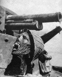 A burned, severed Japanese head propped up on a Japanese tank at Guadalcanal (19...
